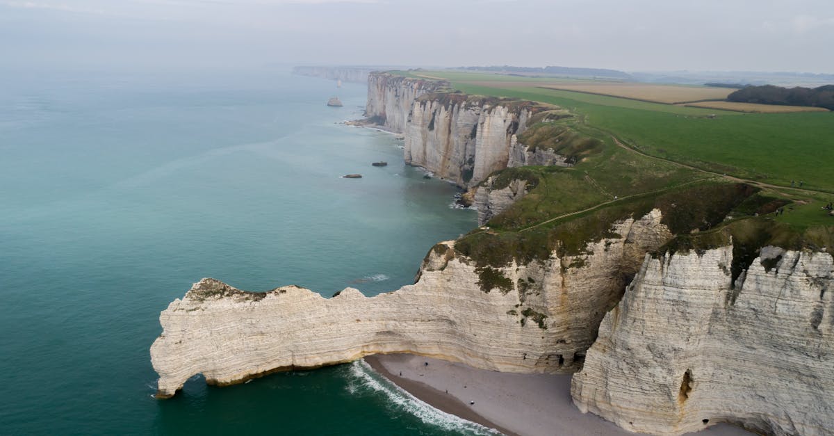 Drone shot capturing the stunning cliffs and coastline of Etretat, Normandy.